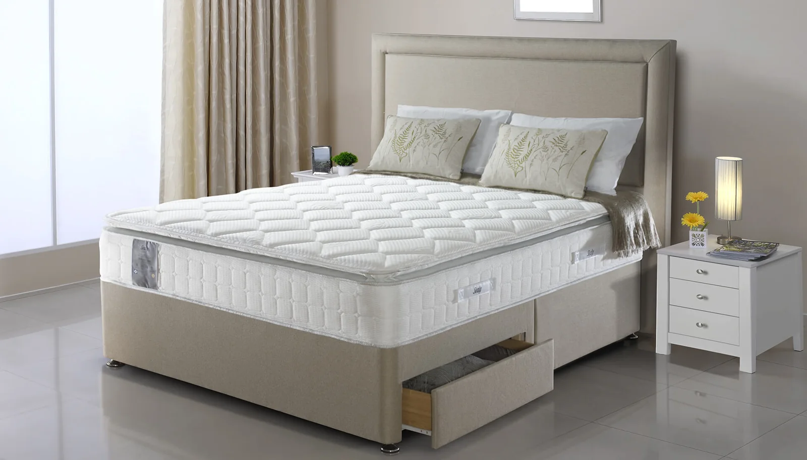Soft neutral bed with a quilted mattress